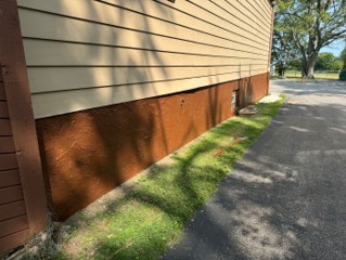 Freshly repainted building after the volunteer repair day